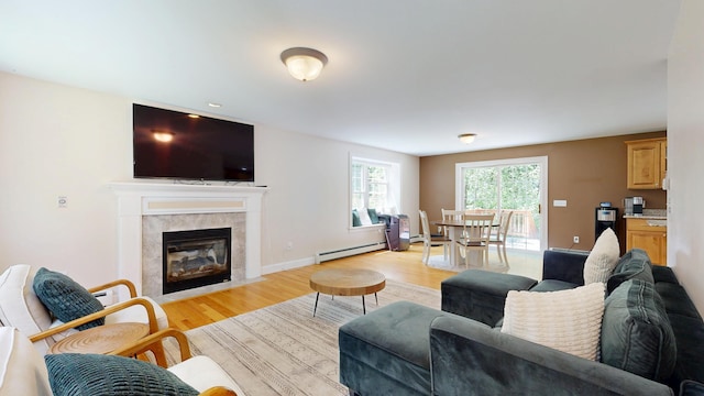 3 Marr Farm Way, Scarborough, ME 04074 - living area featuring a baseboard heating unit, light wood finished floors, and a fireplace