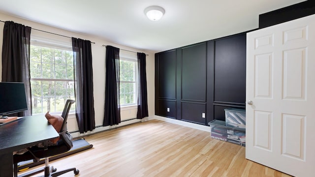 3 Marr Farm Way, Scarborough, ME 04074 - home office featuring light wood-style floors, a decorative wall, and a baseboard radiator