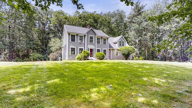 3 Marr Farm Way, Scarborough, ME 04074 - colonial-style house featuring a chimney, a front lawn, and view of scattered trees