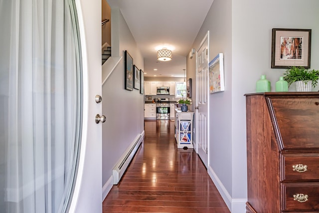 164 State St, Gorham, ME 04038 - hallway with a baseboard radiator and dark wood-type flooring