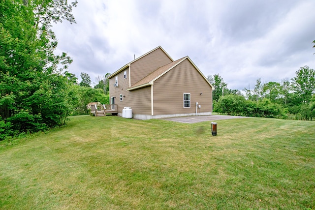164 State St, Gorham, ME 04038 - view of side of property with a deck, a yard, and a patio area