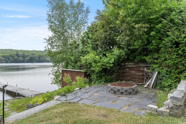 76 Colony Rd, Belgrade, ME 04917 - view of yard with a fire pit, a water view, a dock, and a forest view