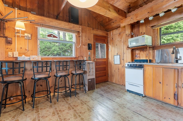 76 Colony Rd, Belgrade, ME 04917 - kitchen featuring white appliances, wooden ceiling, and wooden walls