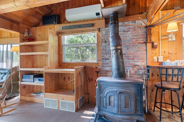 76 Colony Rd, Belgrade, ME 04917 - detailed view of a wood stove, carpet flooring, and wood walls