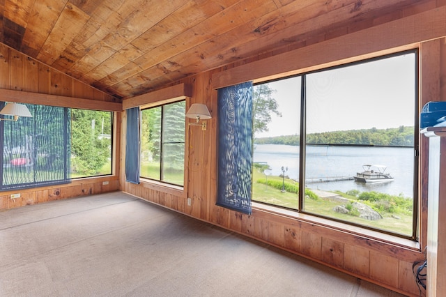 76 Colony Rd, Belgrade, ME 04917 - unfurnished sunroom featuring lofted ceiling, a water view, wood walls, carpet, and wooden ceiling