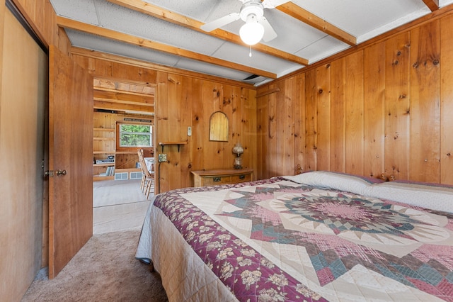 76 Colony Rd, Belgrade, ME 04917 - carpeted bedroom featuring wooden walls and beam ceiling
