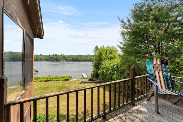 76 Colony Rd, Belgrade, ME 04917 - wooden terrace with a water view and a lawn