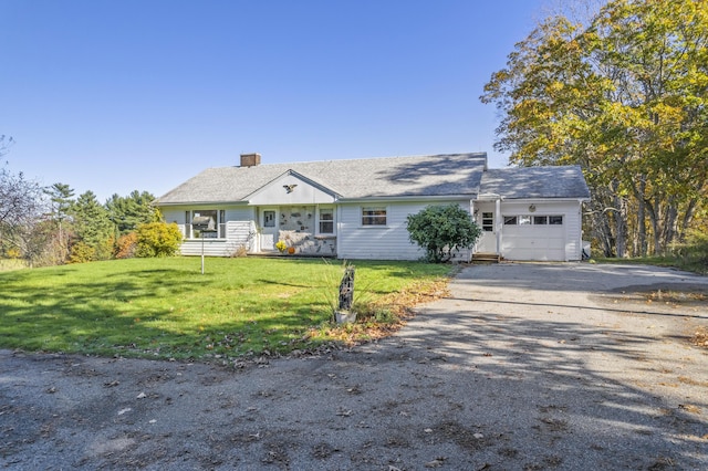 323 Montsweag Rd, Woolwich, ME 04579 - view of front of house featuring driveway, an attached garage, a front lawn, and a chimney
