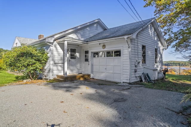 323 Montsweag Rd, Woolwich, ME 04579 - view of front of property with a garage, a chimney, and driveway