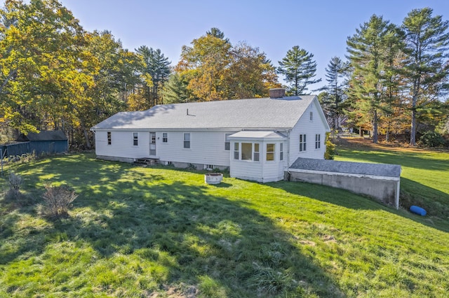 323 Montsweag Rd, Woolwich, ME 04579 - back of house featuring entry steps, a chimney, and a lawn