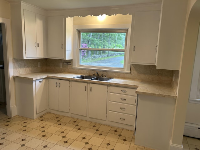 323 Montsweag Rd, Woolwich, ME 04579 - kitchen featuring light countertops, white cabinetry, and tasteful backsplash