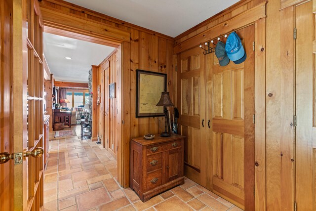 59 Wild Acres Rd, Raymond, ME 04071 - hall featuring wooden walls and light stone finish floors