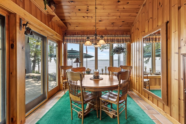 59 Wild Acres Rd, Raymond, ME 04071 - sunroom / solarium featuring lofted ceiling, a water view, and a chandelier