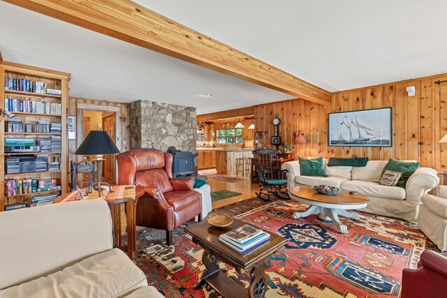 59 Wild Acres Rd, Raymond, ME 04071 - living room with wood walls and beamed ceiling