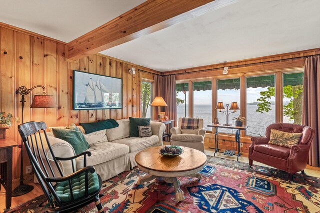 59 Wild Acres Rd, Raymond, ME 04071 - living room with wooden walls, wood finished floors, a water view, and beamed ceiling