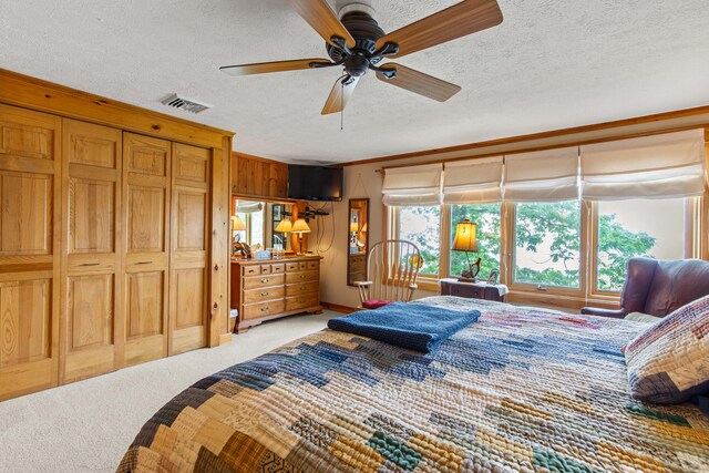 59 Wild Acres Rd, Raymond, ME 04071 - bedroom featuring light colored carpet, a textured ceiling, ceiling fan, and wooden walls