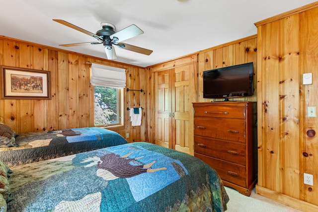 59 Wild Acres Rd, Raymond, ME 04071 - bedroom featuring wood walls, carpet, and ceiling fan