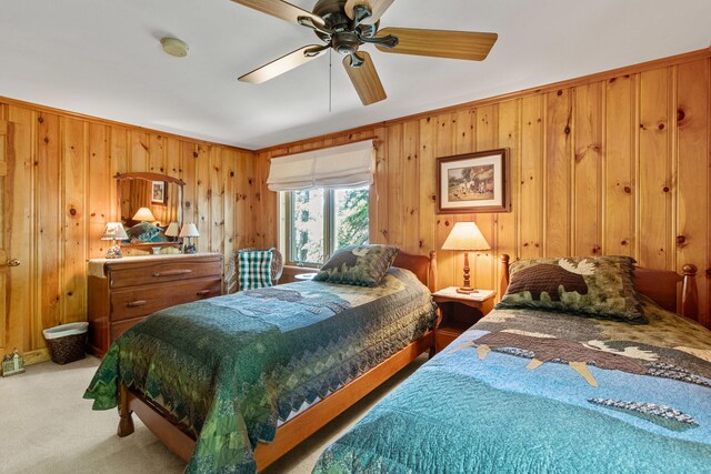 59 Wild Acres Rd, Raymond, ME 04071 - bedroom featuring light colored carpet, wood walls, and ceiling fan