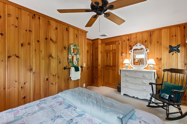 59 Wild Acres Rd, Raymond, ME 04071 - bedroom featuring light carpet, wooden walls, and a ceiling fan