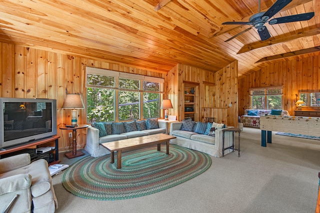 59 Wild Acres Rd, Raymond, ME 04071 - living area featuring lofted ceiling, wood ceiling, a ceiling fan, wood walls, and carpet flooring