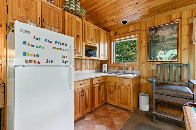 59 Wild Acres Rd, Raymond, ME 04071 - kitchen featuring freestanding refrigerator, black microwave, light tile patterned floors, light countertops, and wood ceiling