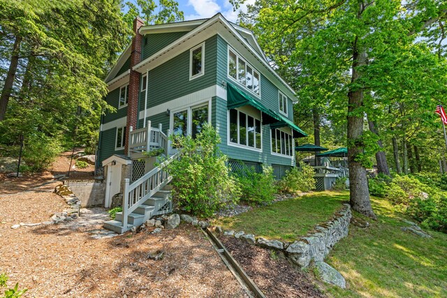 59 Wild Acres Rd, Raymond, ME 04071 - view of front of property featuring a chimney and stairway