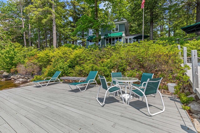 59 Wild Acres Rd, Raymond, ME 04071 - wooden deck featuring view of scattered trees