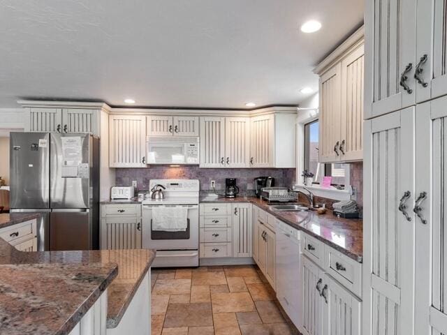 17 White Cap Ln, Wells, ME 04090 - kitchen featuring white appliances, stone finish floors, tasteful backsplash, dark stone counters, and recessed lighting