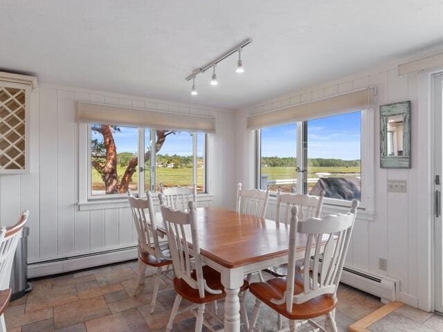 17 White Cap Ln, Wells, ME 04090 - dining area with baseboard heating, light stone finish floors, and rail lighting
