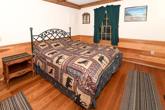115 Fuller Ln, Denmark, ME 04022 - bedroom featuring wood walls, wainscoting, and wood finished floors