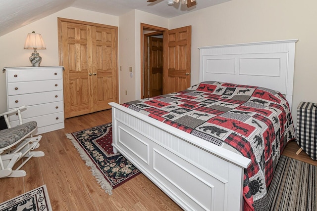 115 Fuller Ln, Denmark, ME 04022 - bedroom with light wood-style flooring, a closet, and vaulted ceiling