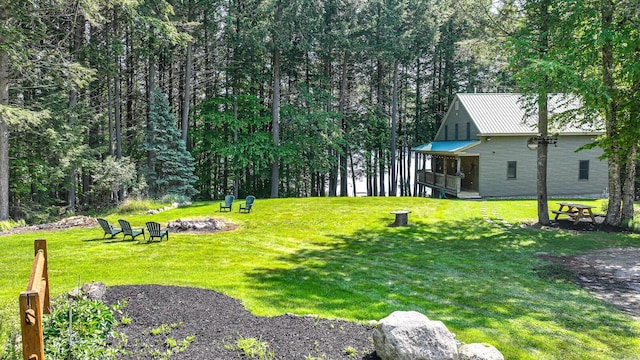 115 Fuller Ln, Denmark, ME 04022 - view of grassy yard with an outdoor fire pit