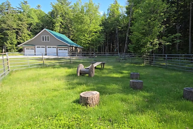 115 Fuller Ln, Denmark, ME 04022 - view of yard featuring a garage, an outdoor structure, and a view of trees