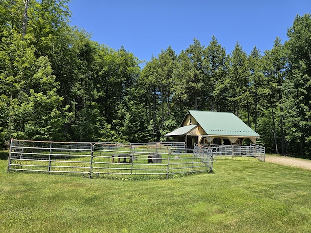 115 Fuller Ln, Denmark, ME 04022 - view of yard featuring an exterior structure, an outbuilding, and a wooded view