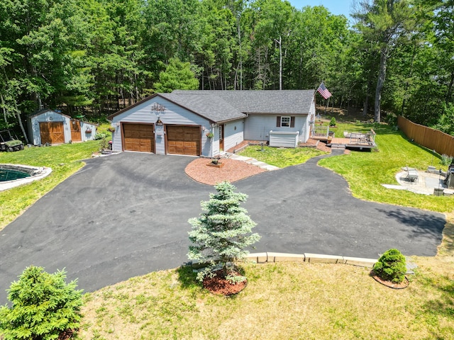 10 Tenacious Way, Augusta, ME 04330 - view of front of property featuring a wooden deck, an outdoor structure, driveway, and an attached garage