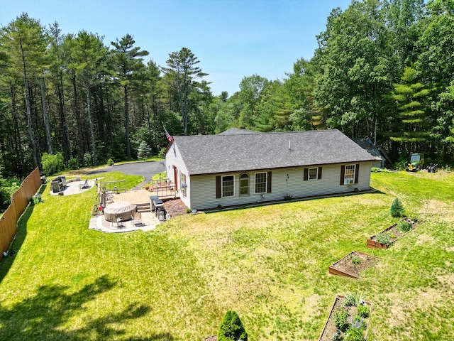 10 Tenacious Way, Augusta, ME 04330 - back of house with a garden, a deck, an outdoor fire pit, and a wooded view