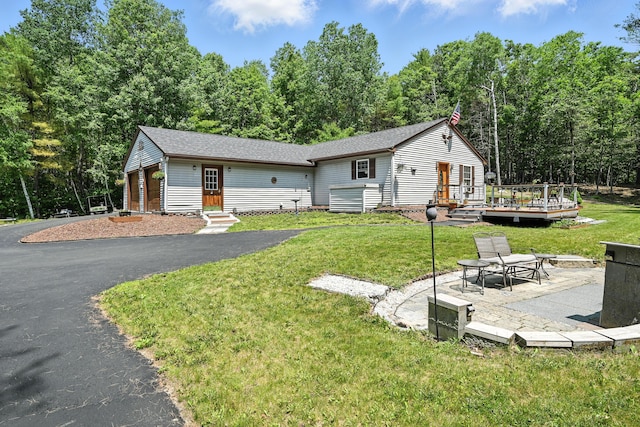 10 Tenacious Way, Augusta, ME 04330 - view of front of house with a deck, a front lawn, and a patio area