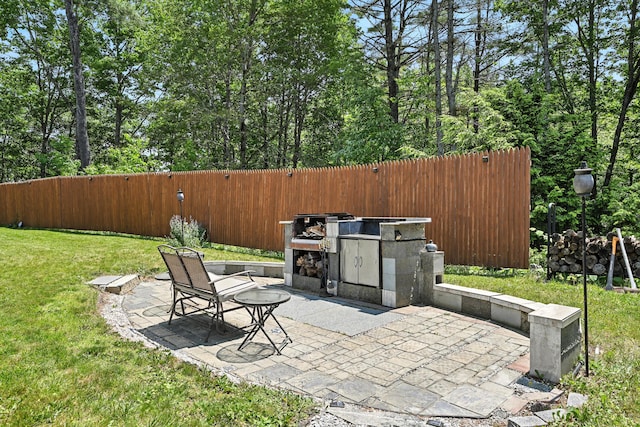 10 Tenacious Way, Augusta, ME 04330 - view of patio featuring exterior kitchen