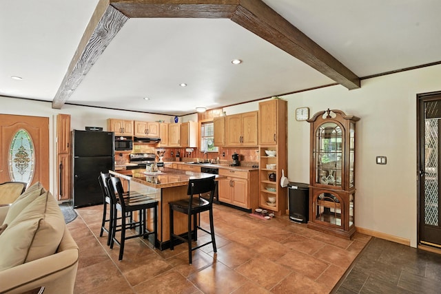 10 Tenacious Way, Augusta, ME 04330 - kitchen with black appliances, plenty of natural light, beam ceiling, a breakfast bar, and light brown cabinetry