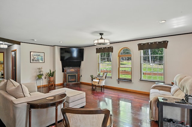 10 Tenacious Way, Augusta, ME 04330 - living room featuring plenty of natural light, hardwood / wood-style floors, a warm lit fireplace, ornamental molding, and recessed lighting