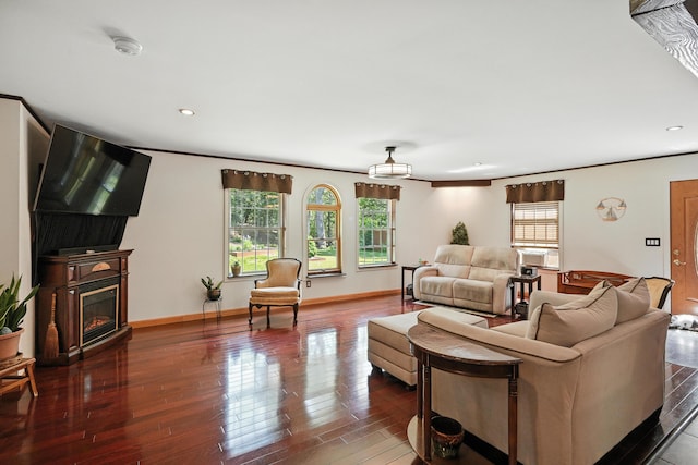 10 Tenacious Way, Augusta, ME 04330 - living area featuring healthy amount of natural light, a glass covered fireplace, wood finished floors, and recessed lighting