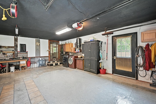 10 Tenacious Way, Augusta, ME 04330 - garage featuring washer and clothes dryer, a garage door opener, and a workshop area