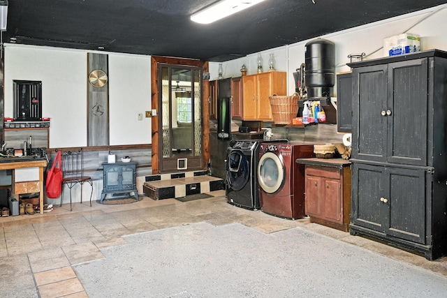 10 Tenacious Way, Augusta, ME 04330 - basement with washer and dryer and a wood stove