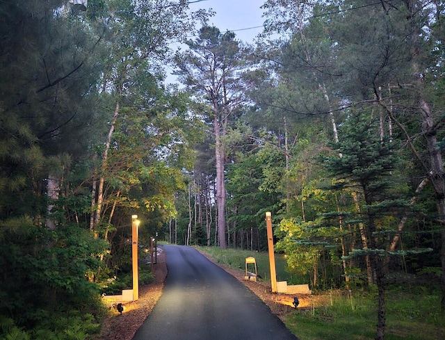 10 Tenacious Way, Augusta, ME 04330 - view of asphalt road featuring a wooded view