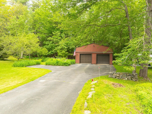 260 Coombs Rd, Brunswick, ME 04011 - view of front of home with an outbuilding, a detached garage, and a front lawn