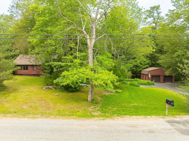 260 Coombs Rd, Brunswick, ME 04011 - view of front of home featuring an outdoor structure, a garage, and a front lawn