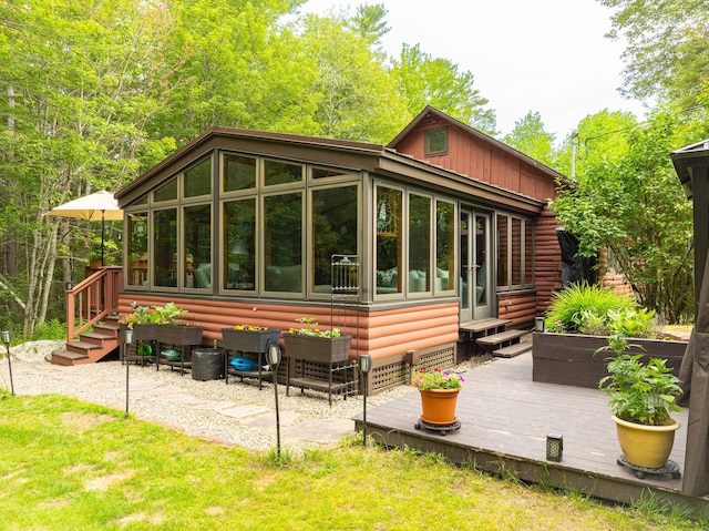 260 Coombs Rd, Brunswick, ME 04011 - back of property featuring a sunroom, a deck, and log veneer siding