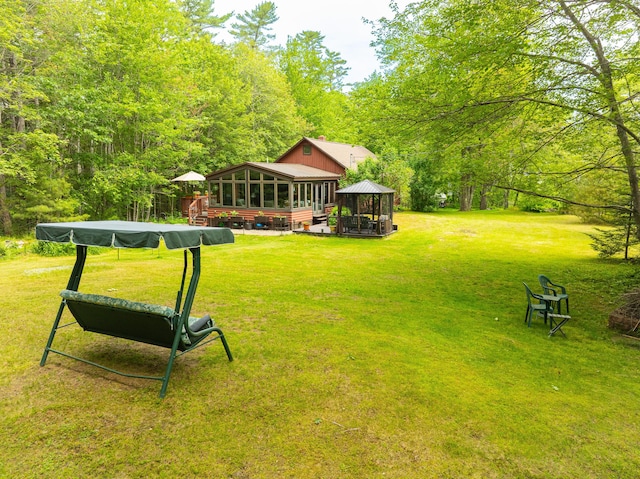 260 Coombs Rd, Brunswick, ME 04011 - view of grassy yard featuring a gazebo, a sunroom, and a wooded view