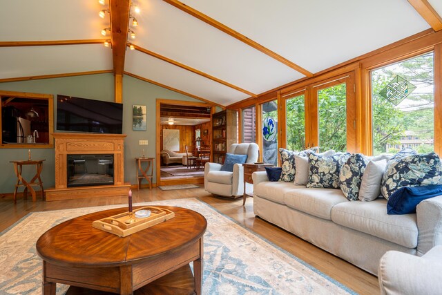 260 Coombs Rd, Brunswick, ME 04011 - living area with plenty of natural light, wood finished floors, and lofted ceiling
