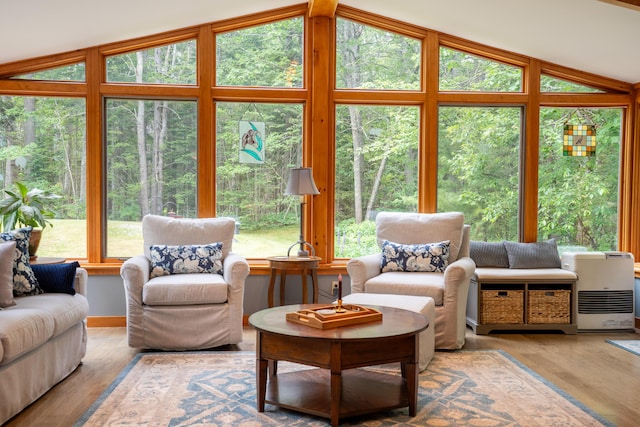 260 Coombs Rd, Brunswick, ME 04011 - living room with lofted ceiling, plenty of natural light, and wood finished floors
